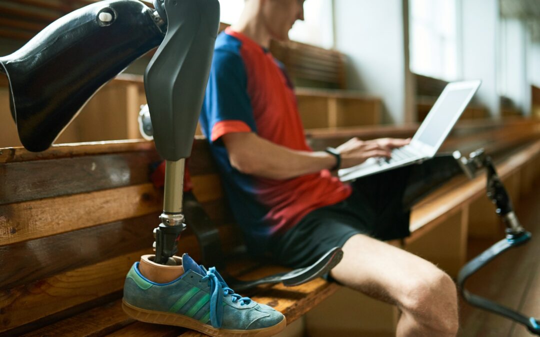 disabled sportsman using laptop